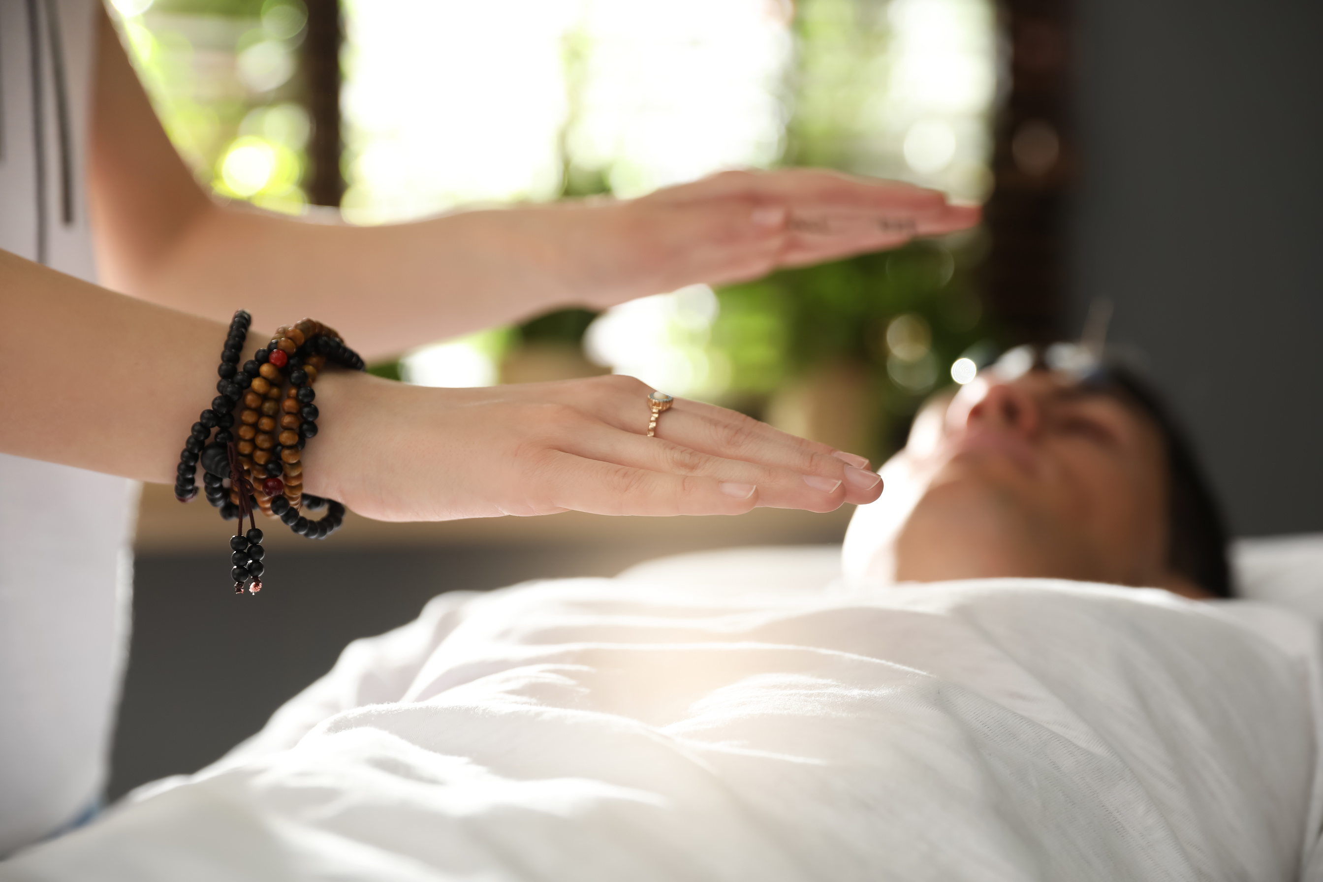 Man during Crystal Healing Session in  Room